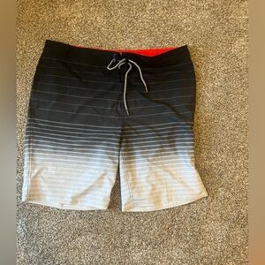 Men’s size 40, swim board shorts. Never worn, new without tags.